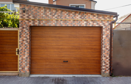 Dark Wooden Garage Door with colored brick wall background